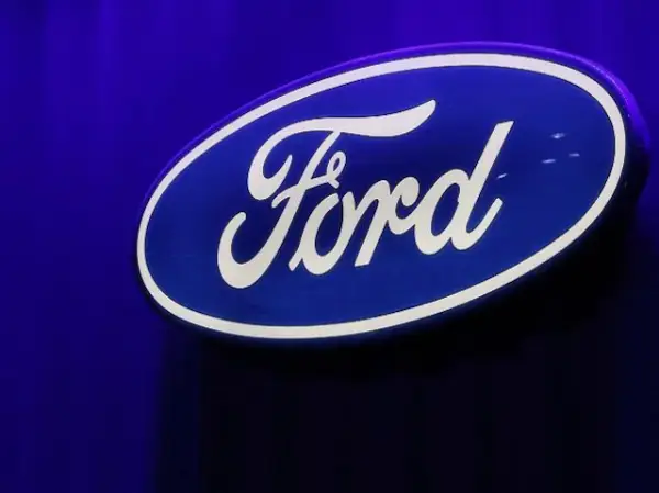 Ford Motor Co posts lower profit, issues downbeat outlook; shares drop