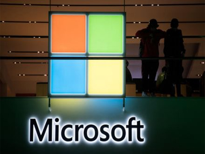 Microsoft reports loss in past quarter due to tax charge