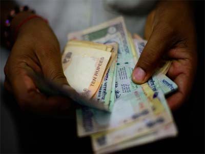 Rupee trades lower at 66.49 against US dollar