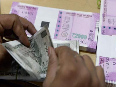 Rupee strengthens against US dollar ahead of Gujarat exit polls
