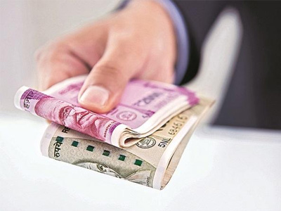 Rupee declines 12 paise against US dollar in early trade