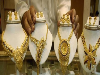 Gold prices remain near record high, silver rates surge