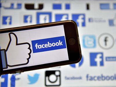 Facebook shares slide after reports of data misuse