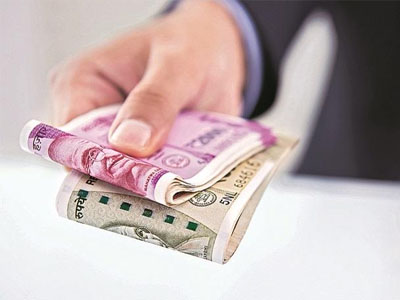 Rupee opens 5 paise higher at 71.29 against US dollar as oil prices slip