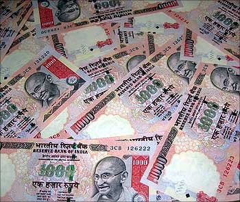 Rupee down to two-year low; trades at 66.99 vs dollar