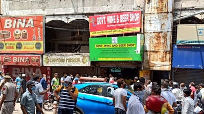 Long queues, social distancing norms flouted: Why states are risking spread of coronavirus to open liquor stores?